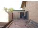 Brick patio featuring neutral home exterior, a storage shed, and comfortable bench at 4606 W Continental Dr, Glendale, AZ 85308