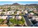 Aerial view of a residential community showcasing beautiful homes, desert landscaping, and mountain views at 4741 W Kristal Way --, Glendale, AZ 85308