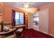 Bedroom featuring tile floors, sliding closet doors, and natural light at 4741 W Kristal Way --, Glendale, AZ 85308