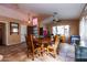 Cozy dining room featuring tile floors, a ceiling fan, and an adjacent home office at 4741 W Kristal Way --, Glendale, AZ 85308