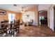 Open concept dining room featuring tile flooring, decorative mirror, and view to the living room at 4741 W Kristal Way --, Glendale, AZ 85308