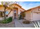 Inviting front entrance featuring beautiful desert landscaping and a security door at 4741 W Kristal Way --, Glendale, AZ 85308