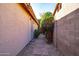 Narrow side yard with stone pathway and access gate at 4741 W Kristal Way --, Glendale, AZ 85308