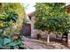 Side yard with a stone path, mature lemon tree, and gate at 4741 W Kristal Way --, Glendale, AZ 85308