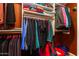 Organized walk-in closet featuring shelves, hanging rods, and colorful clothing and accessories at 4741 W Kristal Way --, Glendale, AZ 85308