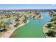 Aerial view of a scenic park with playground, lake, and lush green trees at 5094 N 83Rd St, Scottsdale, AZ 85250