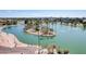 Beautiful aerial view of a lake with a palm tree island and walking path at 5094 N 83Rd St, Scottsdale, AZ 85250