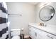 Bright bathroom features white vanity, round mirror, updated fixtures and shower at 5094 N 83Rd St, Scottsdale, AZ 85250