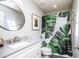 Bright bathroom with a modern vanity and a shower with decorative shower curtain at 5094 N 83Rd St, Scottsdale, AZ 85250