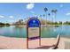 Scenic view of the lake and fishing area, complete with information signage at 5094 N 83Rd St, Scottsdale, AZ 85250