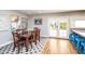 Dining area with a wooden table, six chairs, and doors to the backyard at 5094 N 83Rd St, Scottsdale, AZ 85250