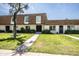 Inviting townhouse with a manicured lawn, tidy landscaping, and covered front entry at 5094 N 83Rd St, Scottsdale, AZ 85250