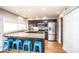 Kitchen featuring a breakfast bar with blue stools, stainless steel appliances, and ample cabinet space at 5094 N 83Rd St, Scottsdale, AZ 85250