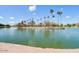 Beautiful lake view with palm trees, an island, and tranquil blue waters at 5094 N 83Rd St, Scottsdale, AZ 85250