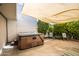 Outdoor patio with a hot tub and seating area under a shaded awning at 5094 N 83Rd St, Scottsdale, AZ 85250