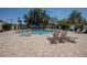 Community pool area with comfortable lounge chairs on a well-maintained patio at 5094 N 83Rd St, Scottsdale, AZ 85250