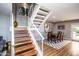 Staircase leading to the dining area, featuring wooden steps and a white railing at 5094 N 83Rd St, Scottsdale, AZ 85250