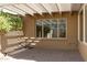 Shaded patio area with brick pavers and a white pergola, perfect for outdoor relaxation and entertaining at 5110 N 78Th St, Scottsdale, AZ 85250