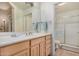 Well-lit bathroom with a large vanity, ample counter space, and a shower at 5303 N 7Th St # 114, Phoenix, AZ 85014