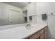 Bright bathroom featuring a single sink, vanity, and a large mirror over the counter at 5303 N 7Th St # 114, Phoenix, AZ 85014