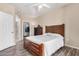 Spacious bedroom with ceiling fan, wood flooring, and a view of the closet at 5303 N 7Th St # 114, Phoenix, AZ 85014