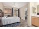 Comfortable bedroom featuring natural lighting, desk, and connecting bathroom at 5303 N 7Th St # 114, Phoenix, AZ 85014
