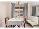 Bright dining area with sliding door access to the patio; modern light fixture at 5303 N 7Th St # 114, Phoenix, AZ 85014