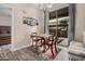 Cozy dining room with a modern chandelier, view to the patio, and neutral tones at 5303 N 7Th St # 114, Phoenix, AZ 85014