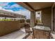 View from covered patio looking out over the complex. Table and chair on patio at 5303 N 7Th St # 114, Phoenix, AZ 85014