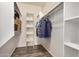 Spacious walk-in closet with shelving units and hanging rods for optimal storage and organization at 5303 N 7Th St # 114, Phoenix, AZ 85014
