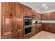 Well-appointed kitchen featuring stainless steel double ovens and granite countertops at 5331 N Pajaro Ct, Litchfield Park, AZ 85340