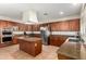 Gourmet kitchen featuring stainless steel appliances, granite countertops, and a functional center island at 5331 N Pajaro Ct, Litchfield Park, AZ 85340