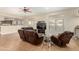 Bright living room featuring an open-concept design with tile floors and comfortable seating at 5331 N Pajaro Ct, Litchfield Park, AZ 85340