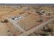 Aerial view of desert property with home, sheds, and clearly marked boundary lines at 53974 W Barrel Rd, Maricopa, AZ 85139