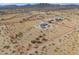 Expansive desert lot with home, outbuildings, and clearly marked boundaries at 53974 W Barrel Rd, Maricopa, AZ 85139