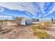 Backyard with several sheds at 53974 W Barrel Rd, Maricopa, AZ 85139