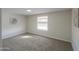 Cozy bedroom with carpet, a window letting in natural light, and calming decor at 53974 W Barrel Rd, Maricopa, AZ 85139