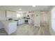 Modern kitchen with white cabinets, stainless steel appliances, and granite countertops at 53974 W Barrel Rd, Maricopa, AZ 85139