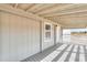 Covered porch featuring painted wood, textured ceiling, and a view of the desert at 53974 W Barrel Rd, Maricopa, AZ 85139