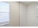 Bright shower featuring white subway tiles, a window, and new fixtures at 53974 W Barrel Rd, Maricopa, AZ 85139