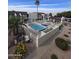 Aerial view of the community pool and surrounding landscaping at 5518 E Lindstrom Ln # 3012, Mesa, AZ 85215