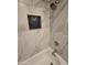 Close up of the shower and white marble-look tiling at 5518 E Lindstrom Ln # 3012, Mesa, AZ 85215