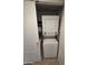 Stacked washer and dryer in utility closet at 5518 E Lindstrom Ln # 3012, Mesa, AZ 85215