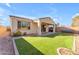 Backyard featuring manicured artificial turf, brick pavers and covered patio at 5637 S 29Th Pl, Phoenix, AZ 85040