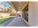 Spacious covered patio with brick pavers that overlooks lush green lawn at 5637 S 29Th Pl, Phoenix, AZ 85040