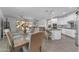 Open concept dining room with table and chairs, leading into a modern kitchen and cozy living space at 5637 S 29Th Pl, Phoenix, AZ 85040