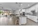 Modern kitchen with white cabinets, granite countertops, pendant lighting, and stainless steel appliances at 5637 S 29Th Pl, Phoenix, AZ 85040