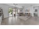 Cozy living room with tile floors, ceiling fans, sliding glass doors to the backyard, and natural light at 5637 S 29Th Pl, Phoenix, AZ 85040