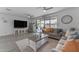 Bright living room features sliding glass doors to patio and ceiling fans at 5637 S 29Th Pl, Phoenix, AZ 85040