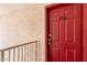 Close-up of a red front door with the unit number 220 at 616 S Hardy Dr # 220, Tempe, AZ 85281